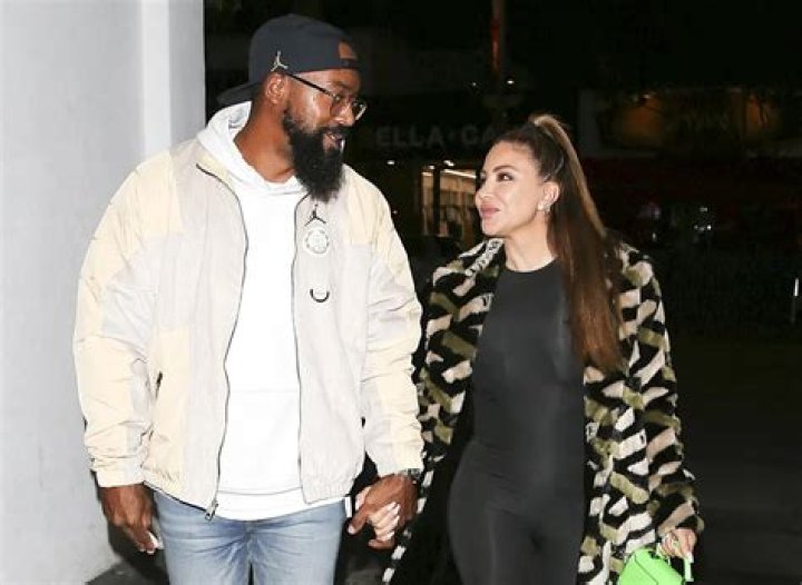 Larsa Pippen holds hands with Malik Beasley