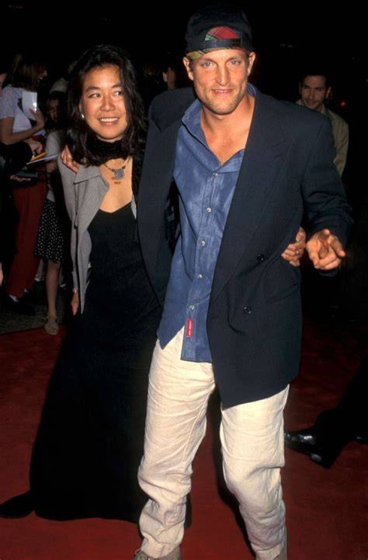 Laura Louie, Woody Harrelson. Laura Louie, left, and Woody Harrelson arrive at the Oscars, at the Dolby Theatre in Los Angeles 90th Academy Awards - Arrivals, Los Angeles, USA - 04 Mar 2018