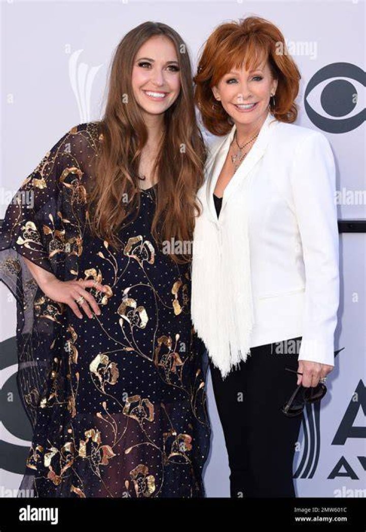 Lauren Daigle, left, and Reba McEntire perform "Back to God" at the 52nd annual Academy of Country Music Awards at the T-Mobile Arena, in Las Vegas 52nd Annual Academy Of Country Music Awards - Show, Las Vegas, USA - 2 Apr 2017