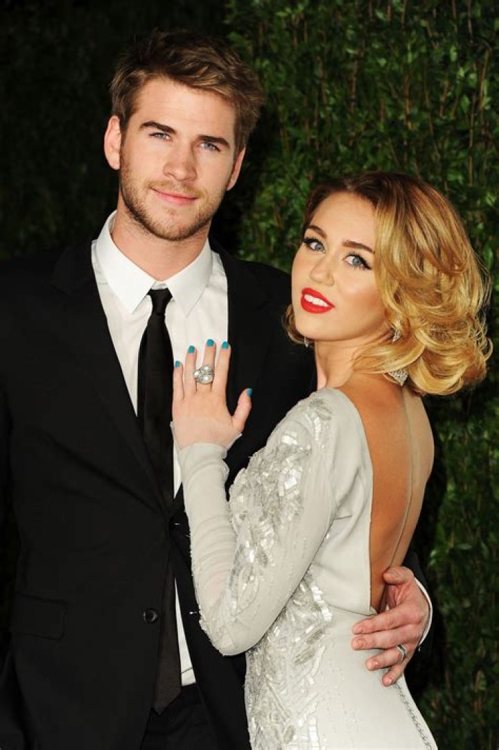 Liam Hemsworth Goes Surfing & Strips Out Of Wetsuit After Sister-In-Law Disses His Ex, Miley Cyrus 
