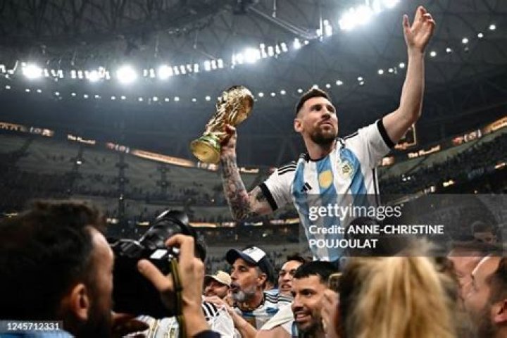 Lionel Messi holds the FIFA World Cup trophy as he deplanes, with coach Lionel Scaloni, in Buenos Aires, Argentina Wcup Soccer, Buenos Aires, Argentina - 20 Dec 2022