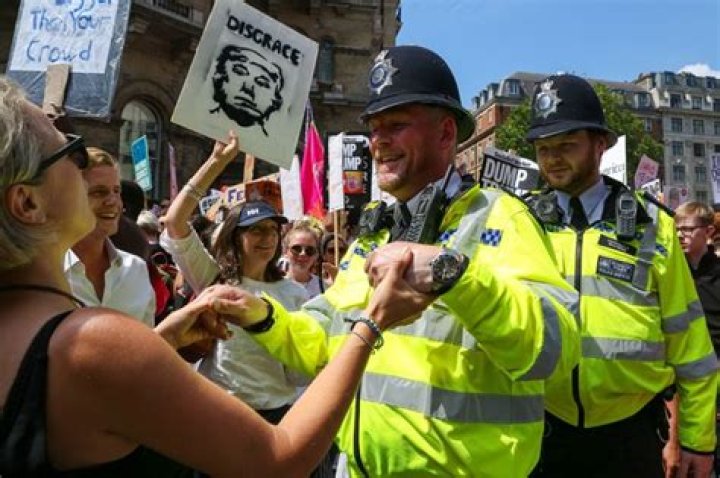 London Police Dance With Marchers