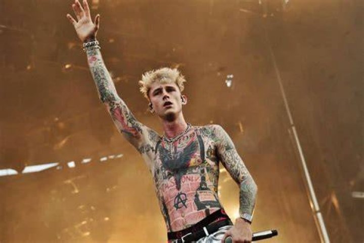 Machine Gun Kelly, left, performs with Avril Lavigne on day two of the Lollapalooza Music Festival, at Grant Park in Chicago 2022 Lollapalooza Music Festival - Day Two, Chicago, United States - 29 Jul 2022