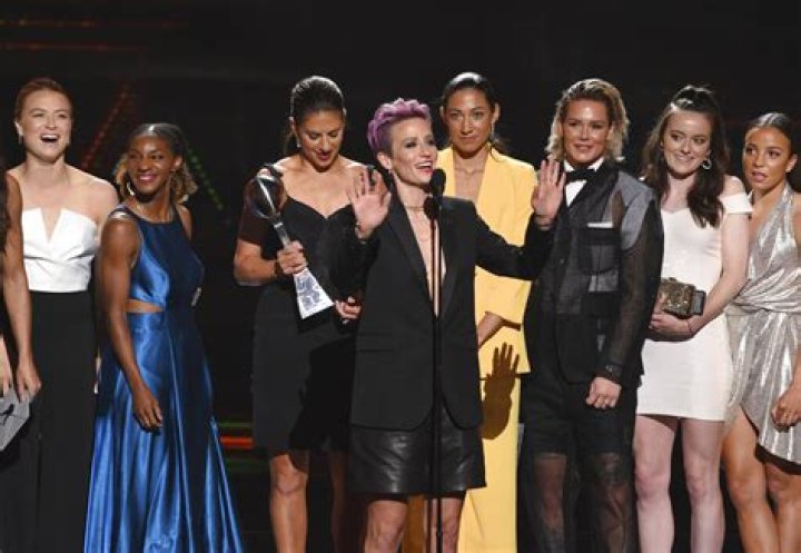 Megan Rapinoe, center, and members of the U.S. women's national soccer team accept the award for best team at the ESPY Awards, at the Microsoft Theater in Los Angeles 2019 ESPY Awards - Show, Los Angeles, USA - 10 Jul 2019