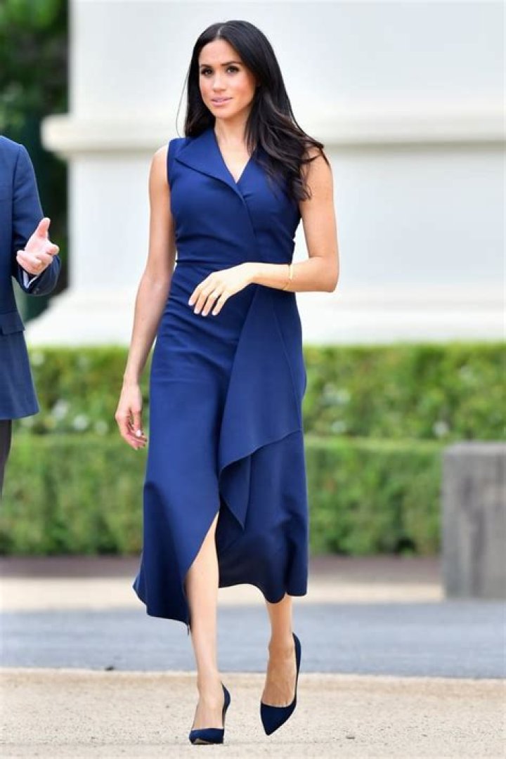 Meghan Markle in a Navy Blue Top, Skirt, and Hat