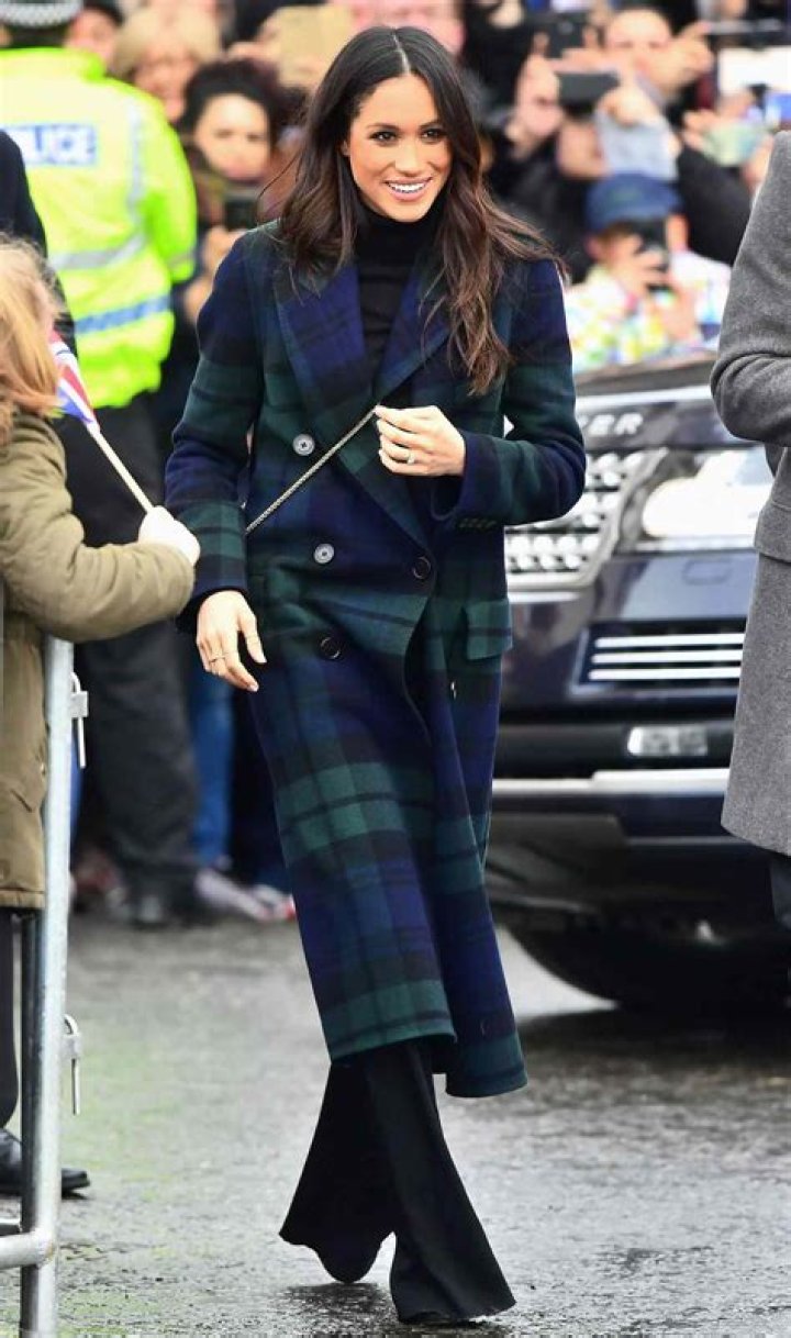 Meghan Markle Wears a Coat Over Her Blue Ensemble