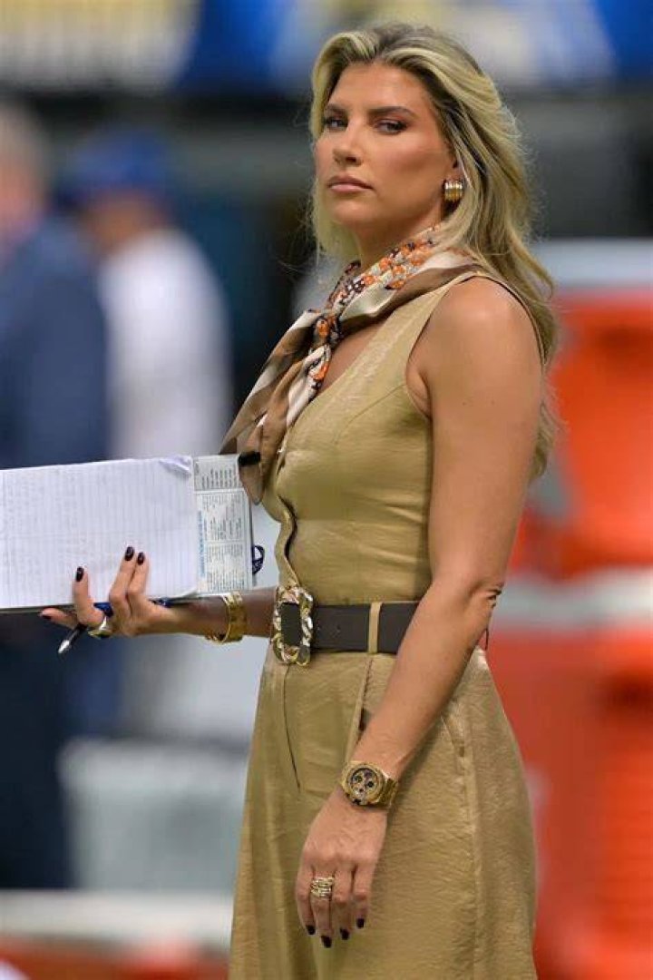 Melanie Collins CBS sideline reporter watches during warm ups before an NFL football game between the Los Angeles Chargers and the Oakland Raiders, in Carson, CalifRaiders Chargers Football, Carson, USA - 22 Dec 2019
