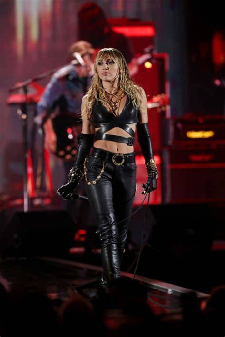 Miley Cyrus’ Hottest Post-Breakup Looks: From Plunging Necklines To BDSM Leather & More