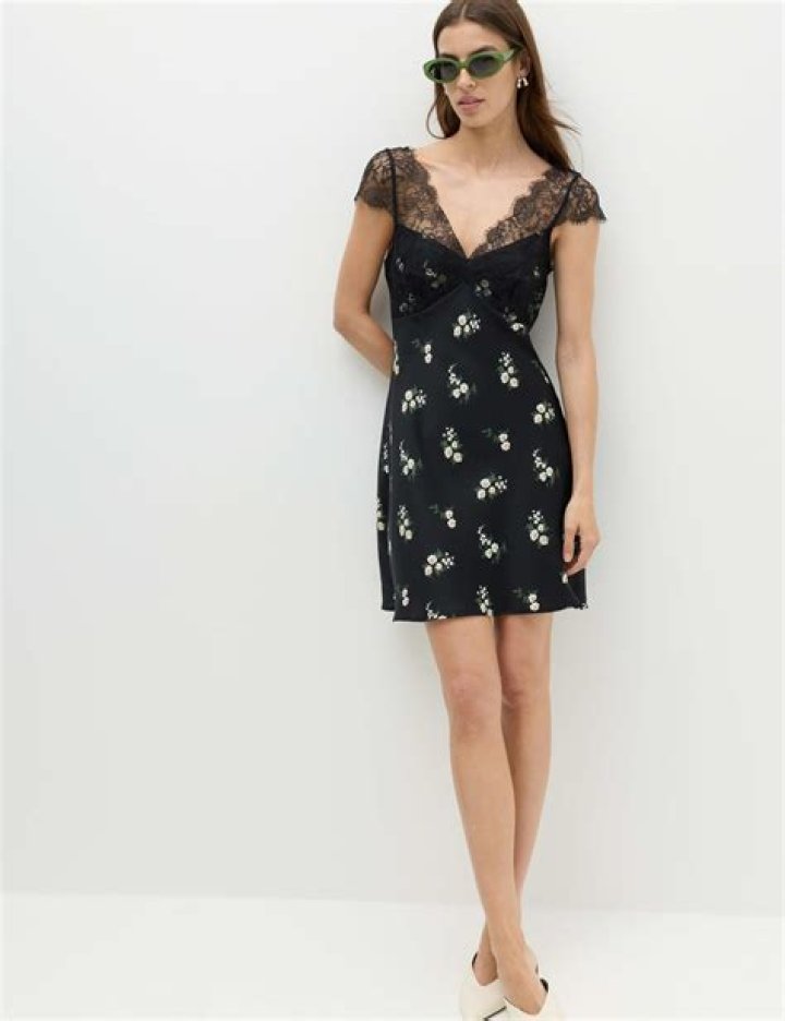 Model in lace floral mini dress at Monique Lhuillier Spring 2016 show