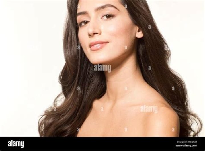 Model Released - Young Woman Applying Suncream Various