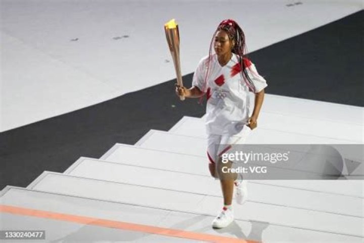 Naomi Osaka carries the Olympic Torch during the opening ceremony in the Olympic Stadium at the 2020 Summer Olympics, in Tokyo, Japan Olympics Opening Ceremony, Tokyo, Japan - 23 Jul 2021