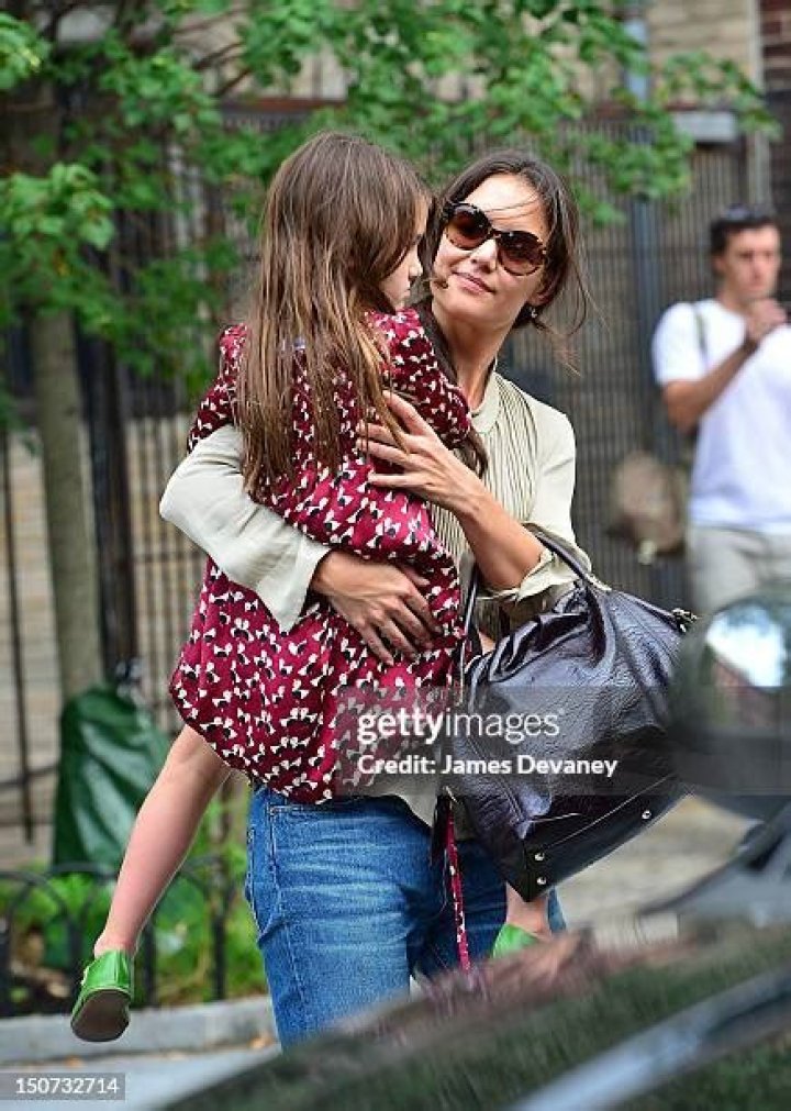 New York, NY - Katie Holmes' ever-growing daughter, Suri Cruise, 16, wears a white dress and blue Converse sneakers for a morning stroll in New York City. Pictured: Suri Cruise BACKGRID USA 20 JULY 2022 BYLINE MUST READ: Robert O'Neil/Backgrid / BACKGRID USA: +1 310 798 9111 / UK: +44 208 344 2007 / *UK Clients - Pictures Containing Children Please Pixelate Face Prior To Publication*