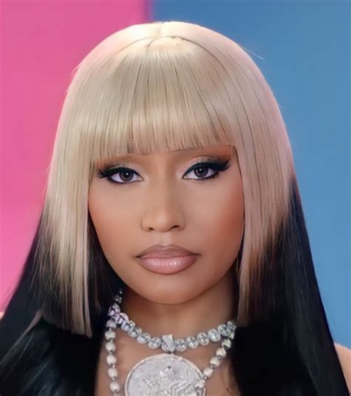 Nicki Minaj hiding her face under shades