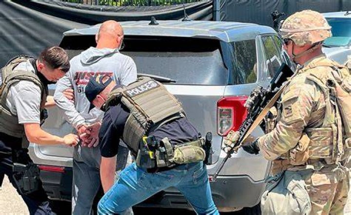 Officers with guns ready