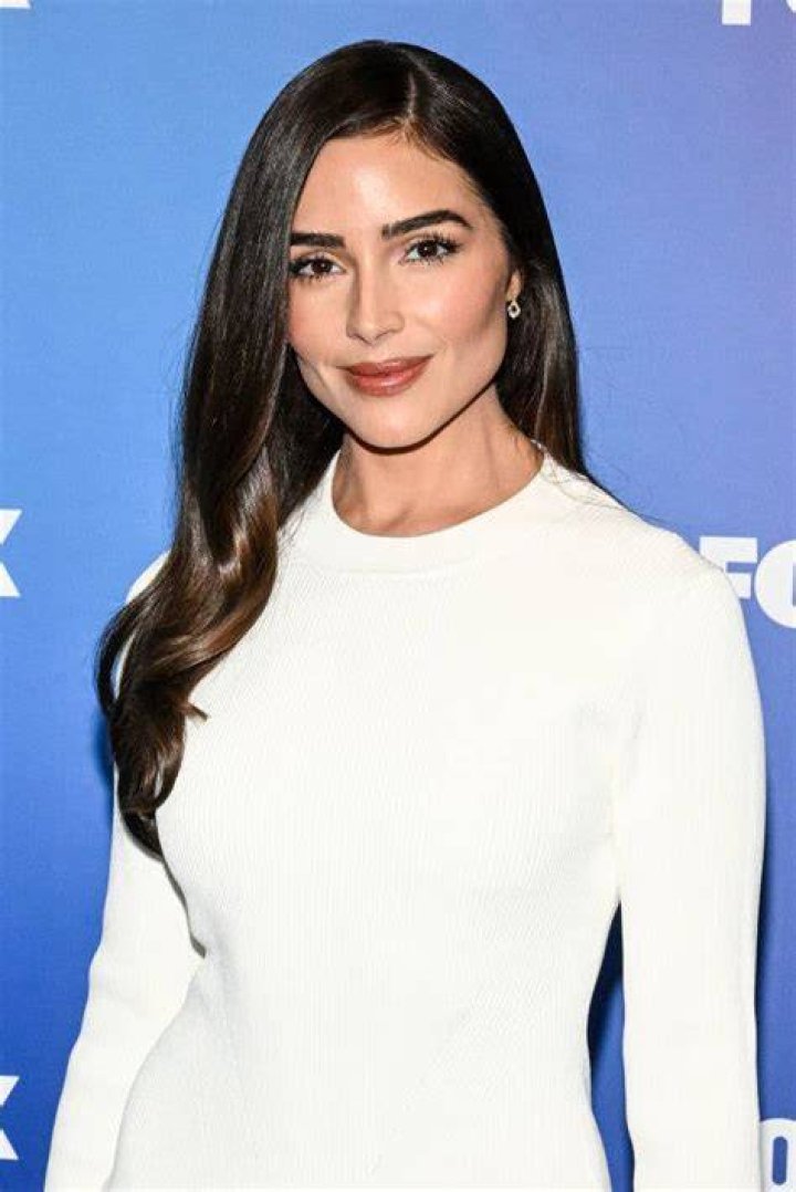 Olivia Culpo poses in a sparkly dress