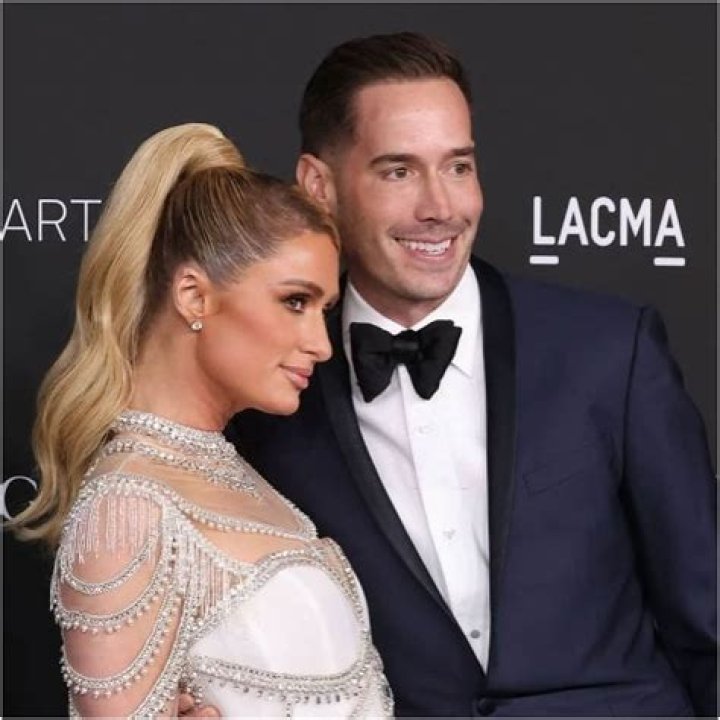 Paris Hilton kisses boyfriend Carter Reum