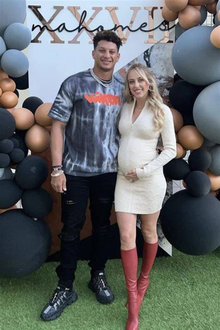 Patrick Mahomes’ Fiancee Brittany Matthews Cradles Her Baby Bump In Black Dress At His NFL Game