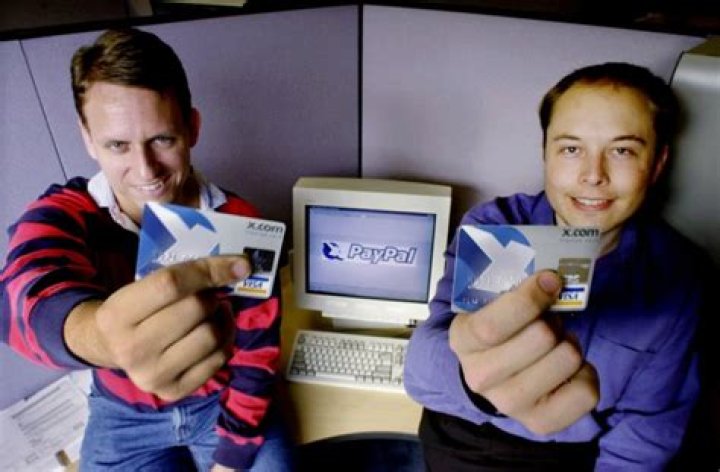Peter thiel, Elon Musk PayPal Chief Executive Officer Peter Thiel, left, and founder Elon Musk, right, pose with the PayPal logo at corporate headquarters in Palo Alto, Calif. Thiel who who co-founded PayPal and gave Facebook its first big investment now wants Silicon Valley to buy into a bigger idea: the future. Thiel is backing groups that see a future when computers will communicate directly with the human brain. Seafaring pioneers will found new floating nations in the middle of the ocean. Science will conquer aging, and death will become a curable diseaseTech Tycoon, PALO ALTO, USA