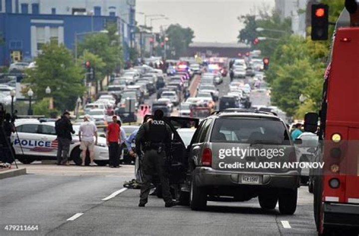 Police arrive at the scene to escort concertgoers to safety after hiding inside the Sands Corporation plane hangar after a gunman opened fire at the Route 91 Harvest Festival, in Las Vegas Shooting, Las Vegas, USA - 02 Oct 2017