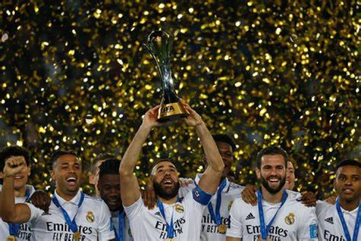 Real Madrid's Isco, left, celebrates with teammates after scoring his side's opening goal during the Champions League, round of 16, first leg soccer match between Real Madrid and Manchester City at the Santiago Bernabeu stadium in Madrid, Spain Soccer Champions League, Madrid, Spain - 26 Feb 2020