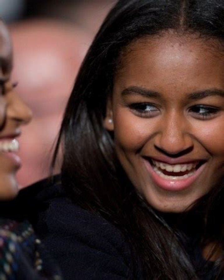 Sasha Obama, Malia Obaman Sasha Obama, right, and Malia Obama, laugh during the National Christmas Tree Lighting ceremony at the Ellipse in Washington Obama National Christmas Tree, Washington, USA