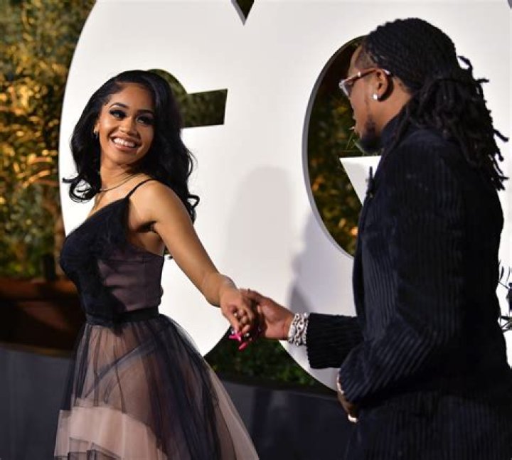 Saweetie, left, and Quavo kiss as they arrive at GQ's Men of the Year Celebration on Thursday, Dec. 5, 2019, in West Hollywood, Calif. (Photo by Richard Shotwell/Invision/AP)