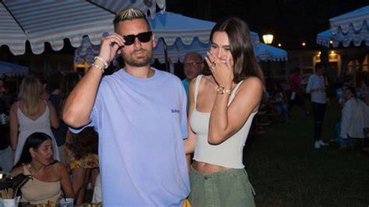 Scott Disick and girlfriend Amelia Hamlin color coordinate in orange hues