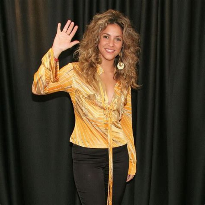 Shakira Sports A Matching Yellow Print Bikini & Shorts In Ibiza With Her Kids