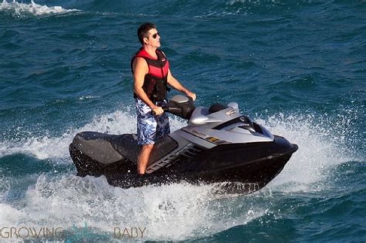 Simon Cowell jet skis in Barbados with his son