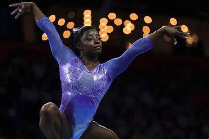 Simone Biles Rocks Sexy Backless Swimsuit & Admits She’s A ‘Happy Gal’