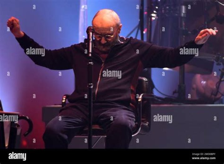 Singer Phil Collins leads Genesis as they play in their "The Last Domino?" tour at the United Center, in Chicago. On drums in background is Collins' son Nicholas Collins Genesis Last Domino? Tour, Chicago, United States - 15 Nov 2021