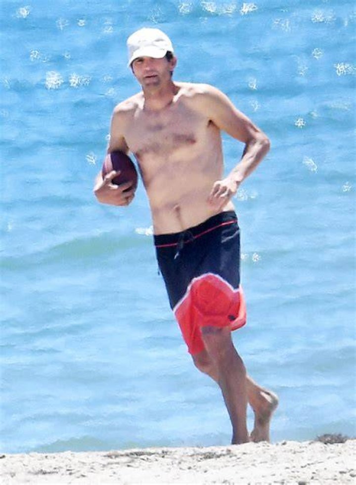 Sizzles In Board Shorts During Beach Day – Hollywood Life