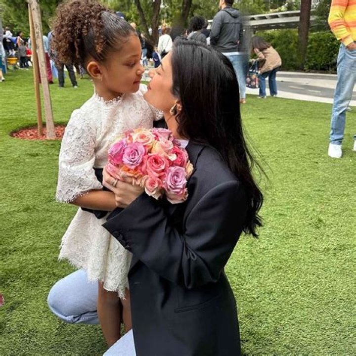 Stormi Webster Holds Hands With Travis Scott & Kylie Jenner
