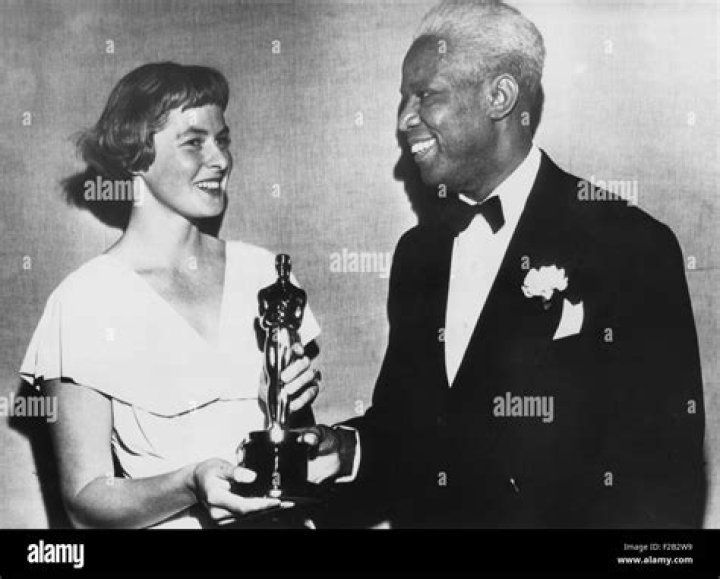 Swedish actress, Ingrid Bergman presents a special Academy Award to actor James Baskett. In March 1948 he was recognized for his role as Uncle Remus in the Disney film, SONG OF THE SOUTH. Historical Collection