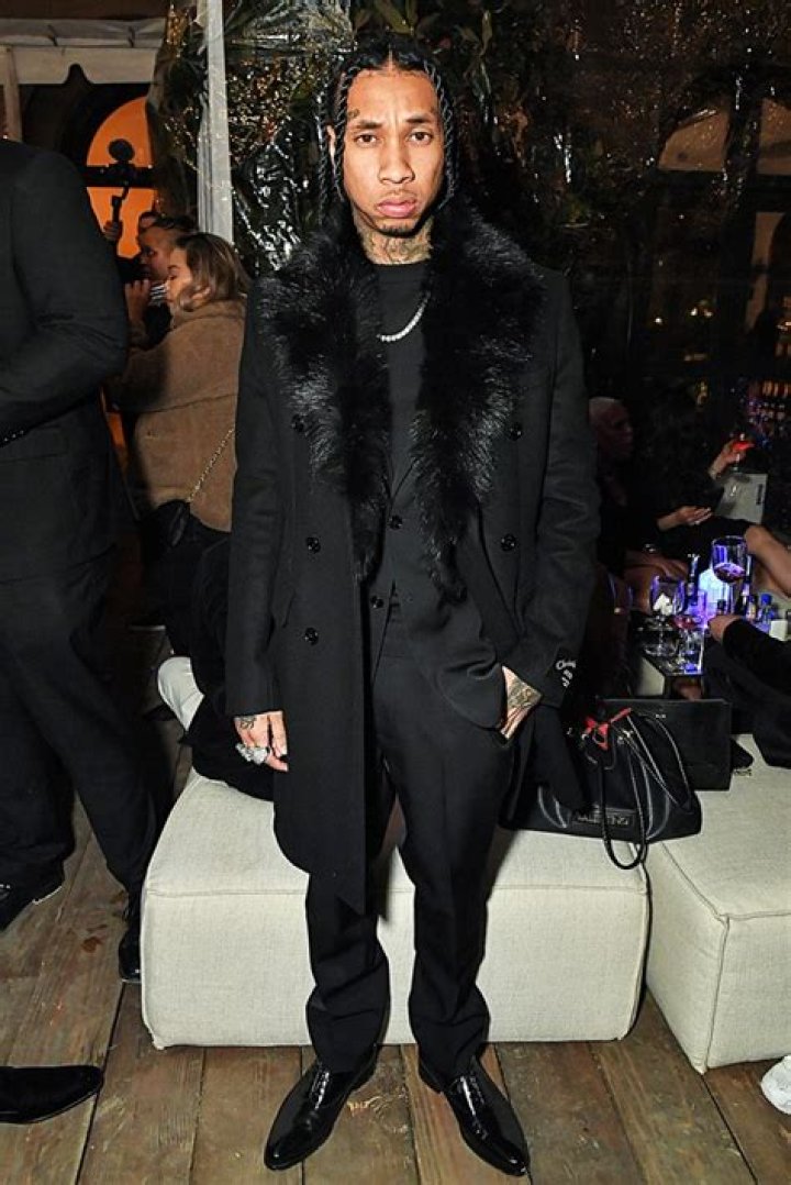 Tyga poses in an impressive outfit