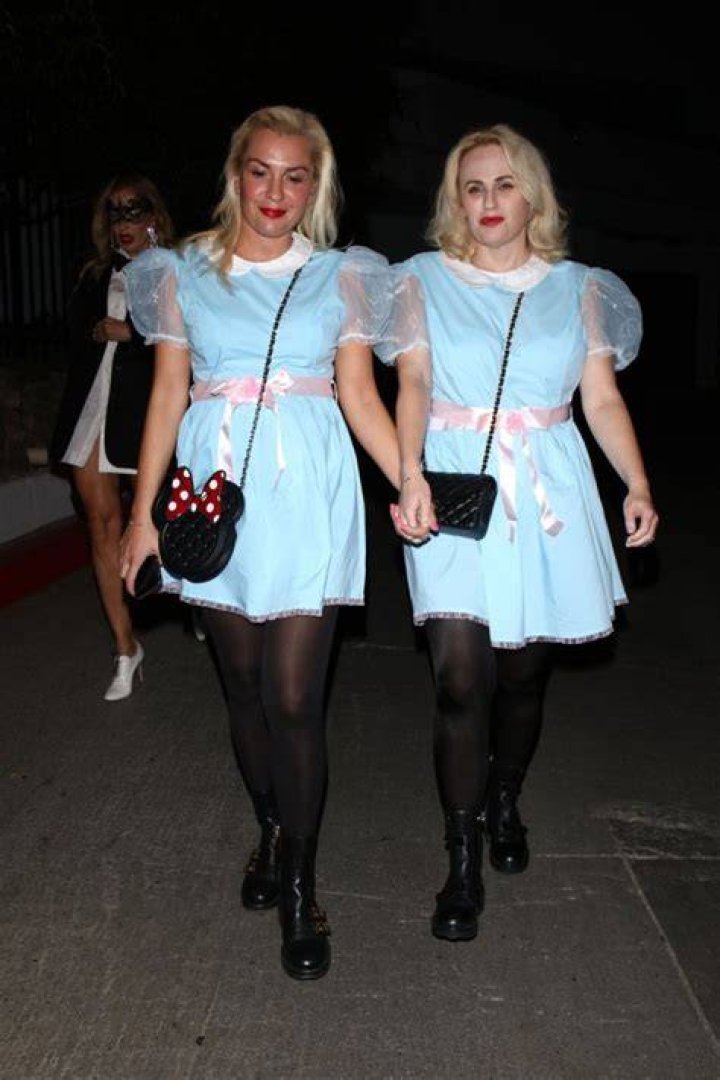 West Hollywood, CA - Comedic actress Rebel Wilson and her girlfriend Ramona Agruma arrive to Vas Morgan and Michael Braun's Halloween party dressed as the twins from 'The Shining.' Pictured: Rebel Wilson, Ramona Agruma BACKGRID USA 29 OCTOBER 2022 USA: +1 310 798 9111 / UK: +44 208 344 2007 / *UK Clients - Pictures Containing Children Please Pixelate Face Prior To Publication*