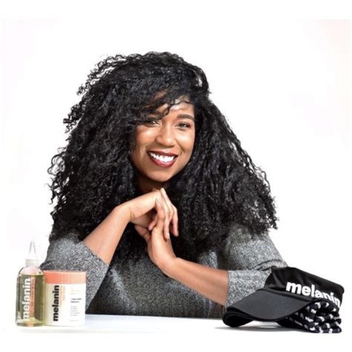 Whitney White with Melanin Haircare products