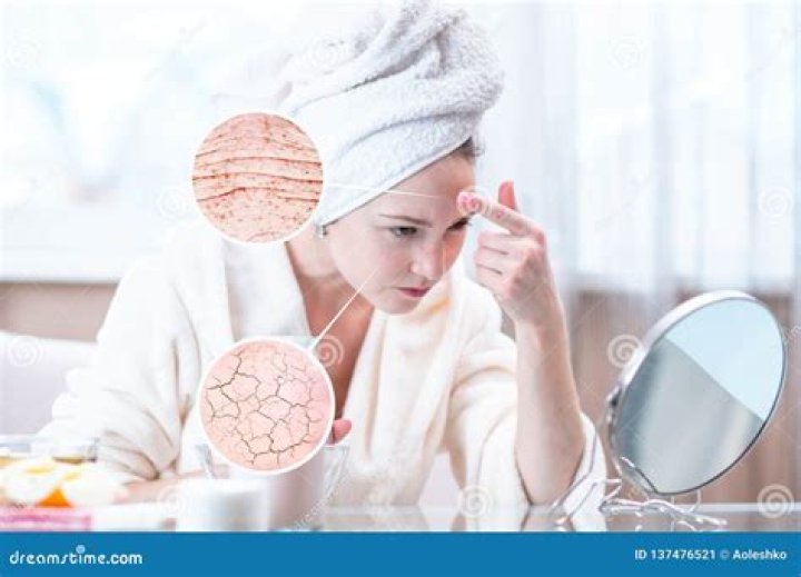 Woman looking at her dry hair